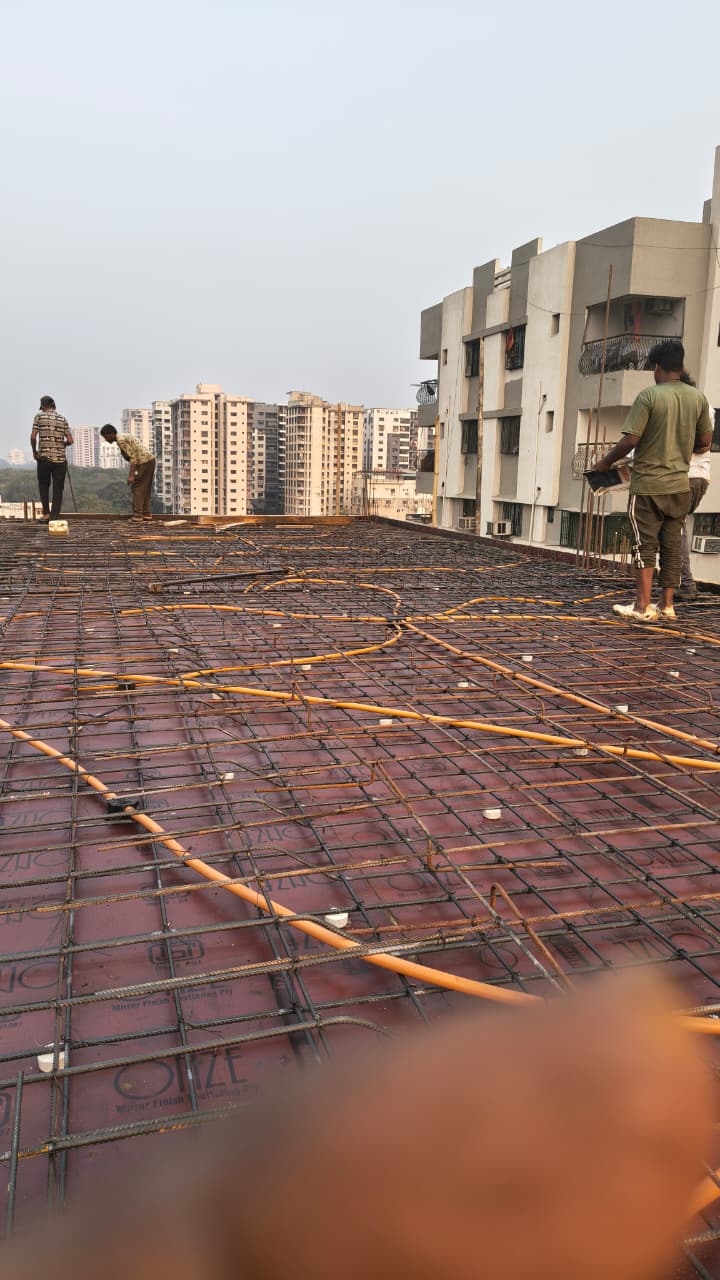 RCC slab casting with steel reinforcement on industrial construction site